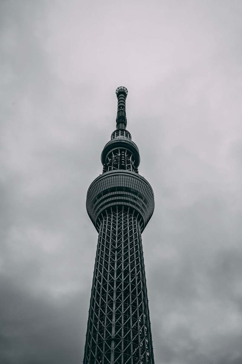 building low-angle photography of black concrete tower tower