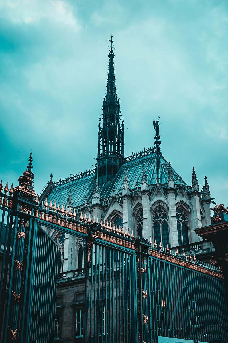 building low-angle photography of blue and gray cathedral spire