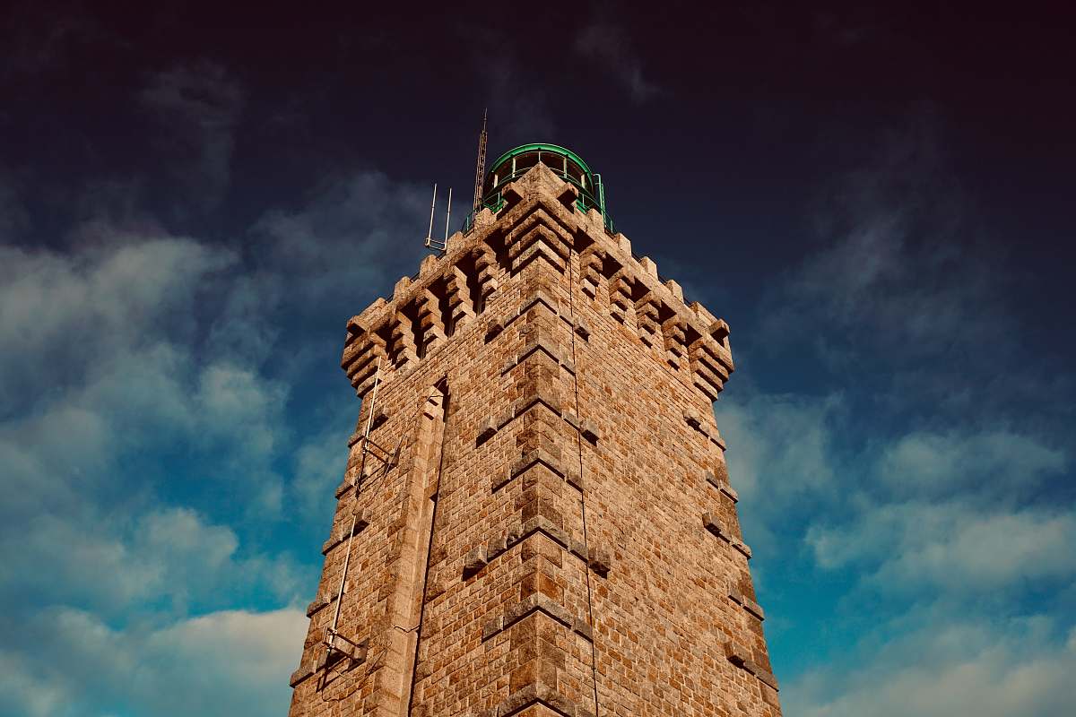 building low-angle photography of brown building tower