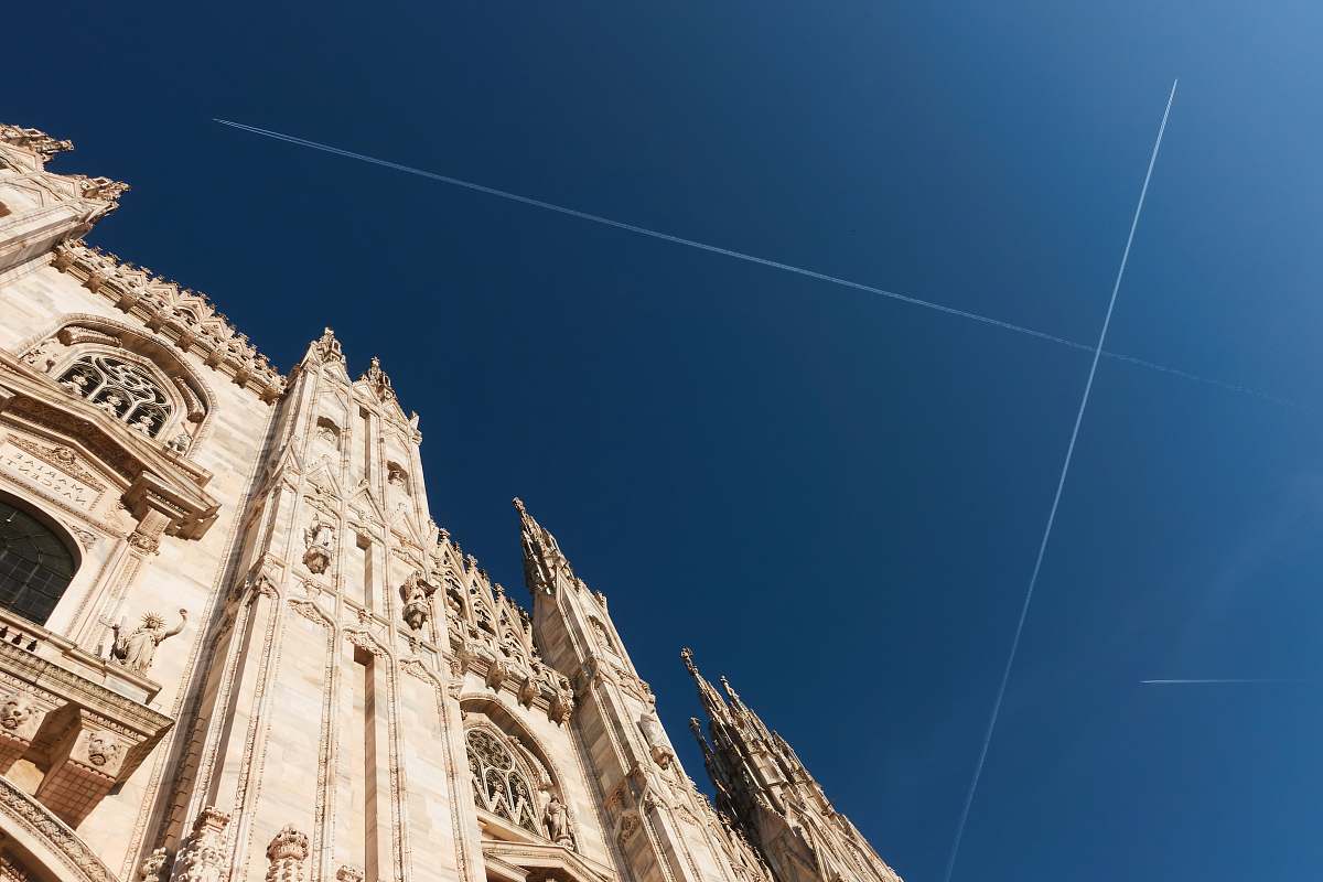 building low angle photography of brown structure spire