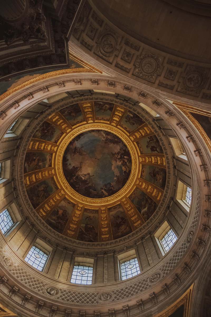 building low-angle photography of building's ceiling paintings apse