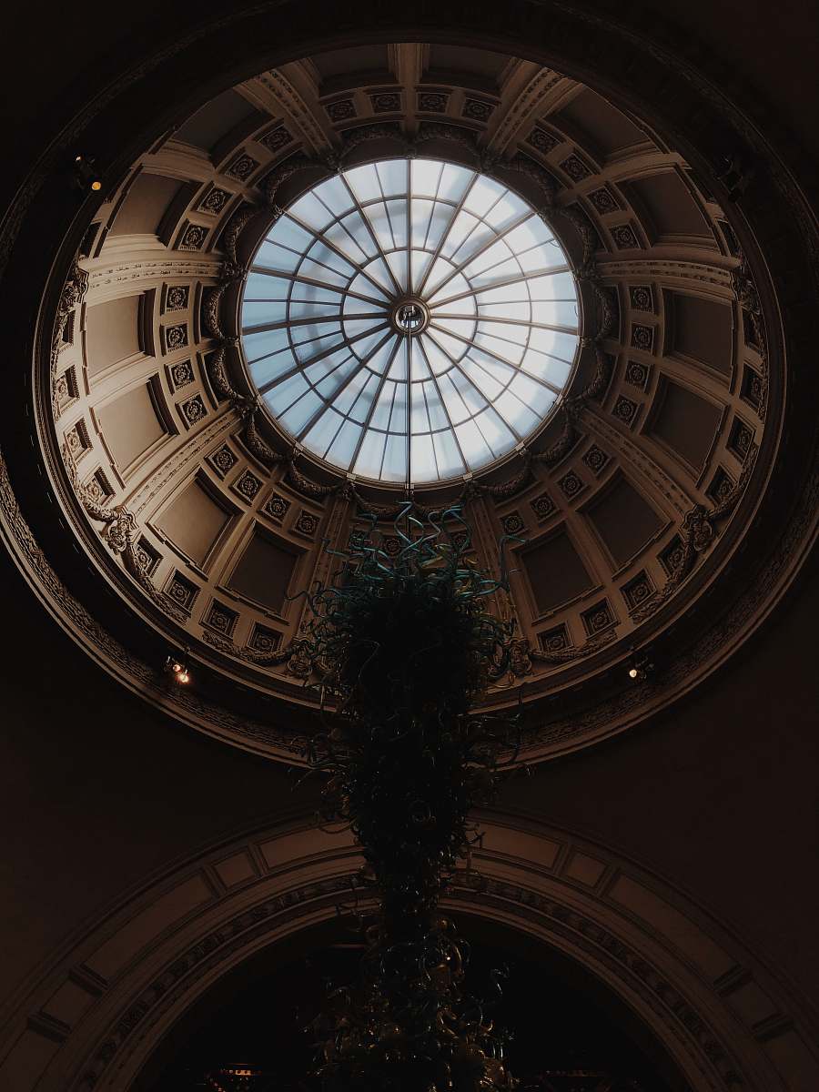building low-angle photography of ceiling of dome building window