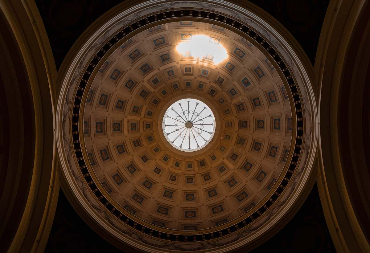 building low-angle photography of dome building ceiling window