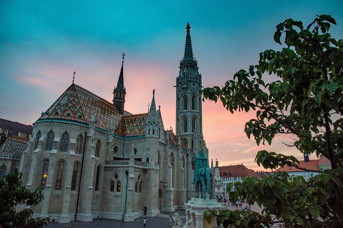 building low-angle photography of gray concrete cathedral during daytime spire