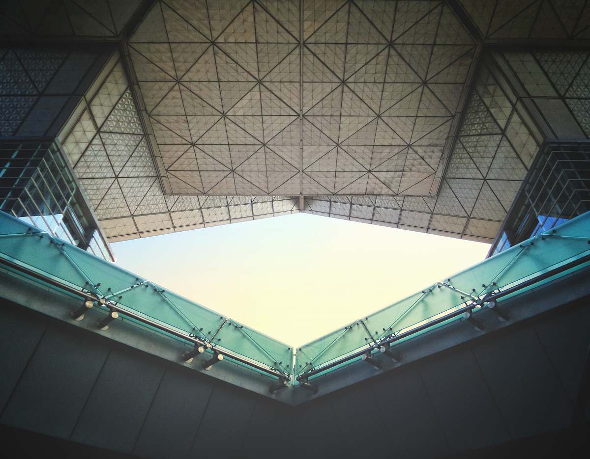 building low angle photography of inside buinding window