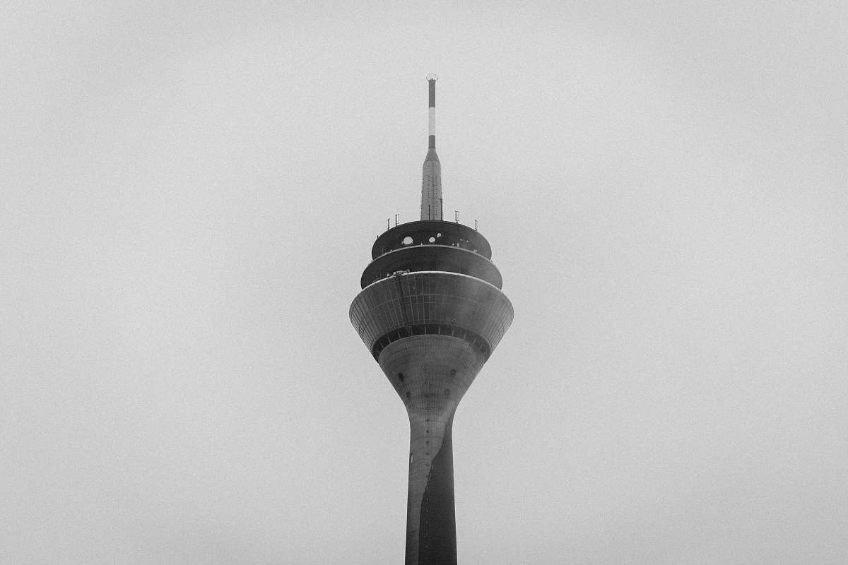 building low-angle photography of tower black-and-white