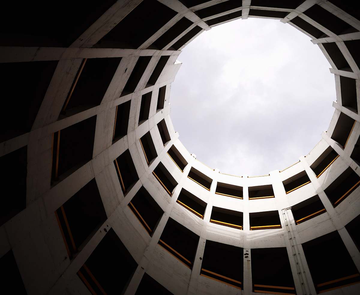 building low angle photography of white concrete building skylight
