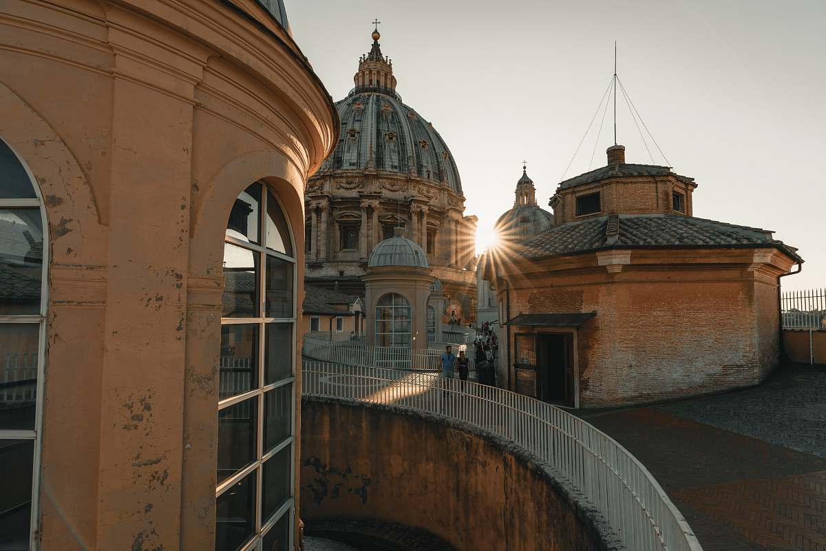 building people beside buildings during day dome