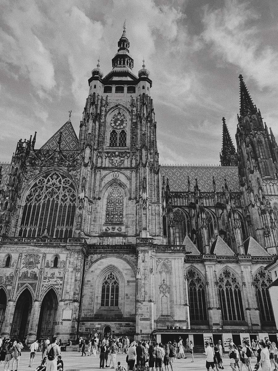 building people outside church grayscale photo black-and-white