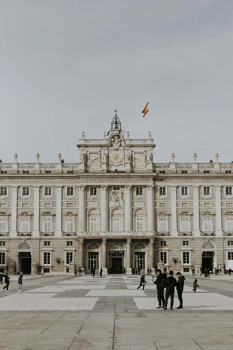 palace people walking near Royal Palace of Madrid house