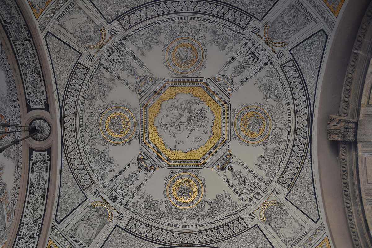 dome photo of white, gray, and yellow building ceiling grey