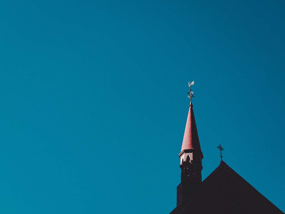 building red and gray tower spire