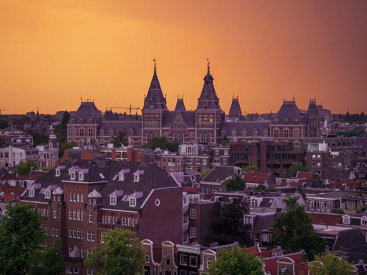 building red buildings and trees aerial view spire