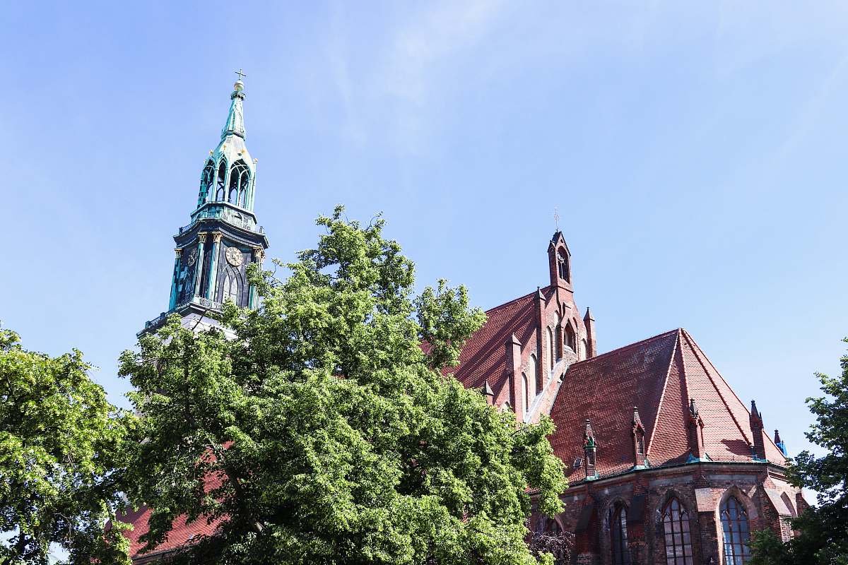 building red church near trees tower