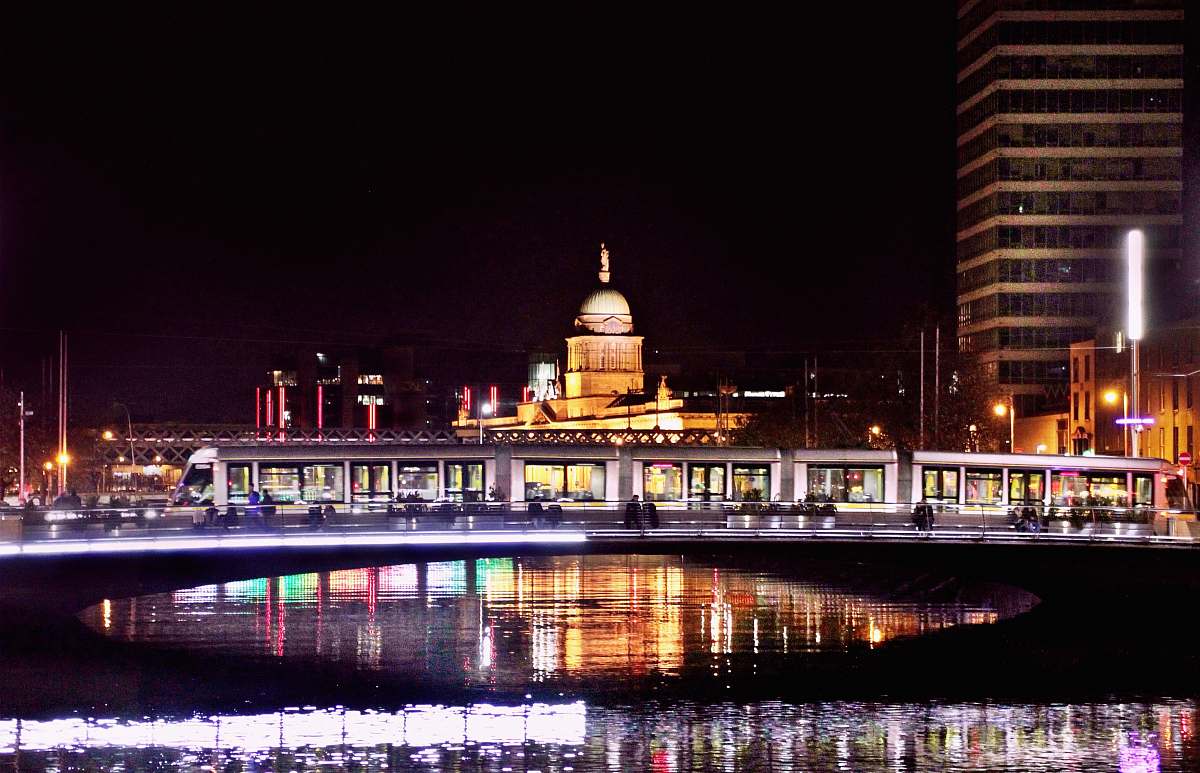 building reflection of buildings light on body of water at night dome