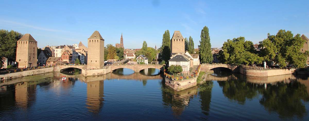 building river beside concrete building castle