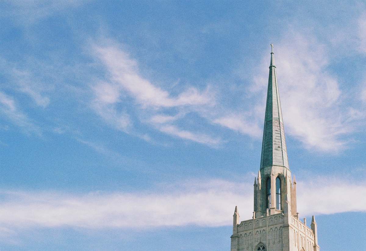 building selective photography of brown building at daytime steeple