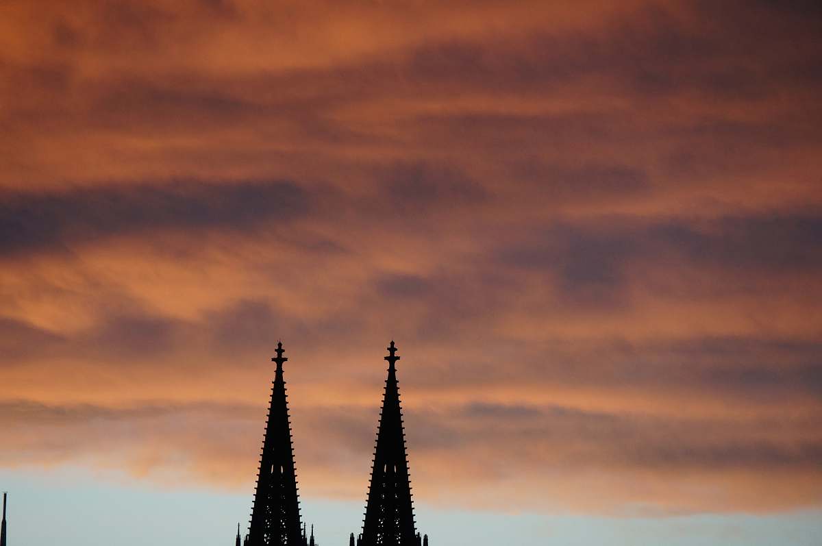 building silhouette photography of towers spire