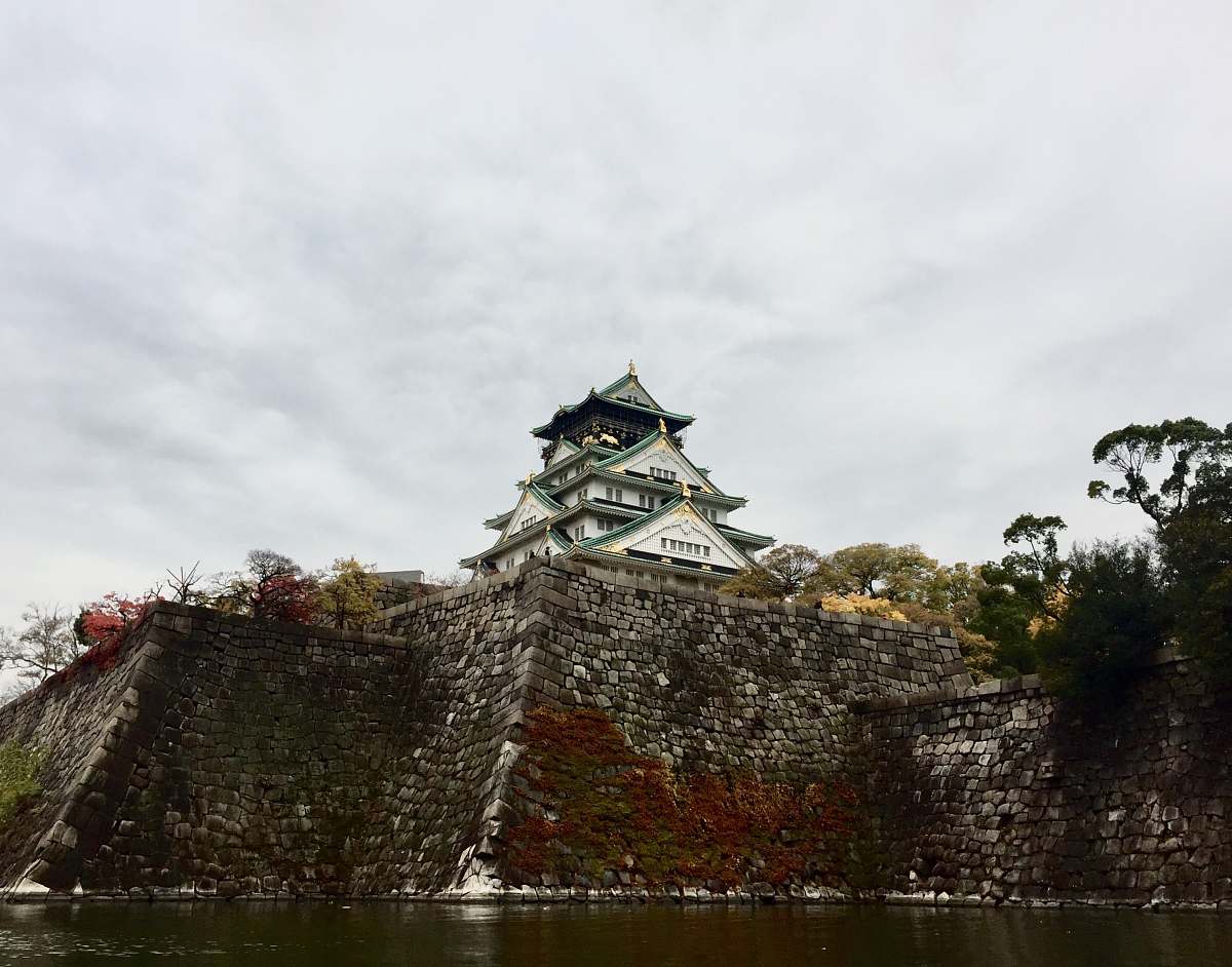 building temple in front of calm body of water castle