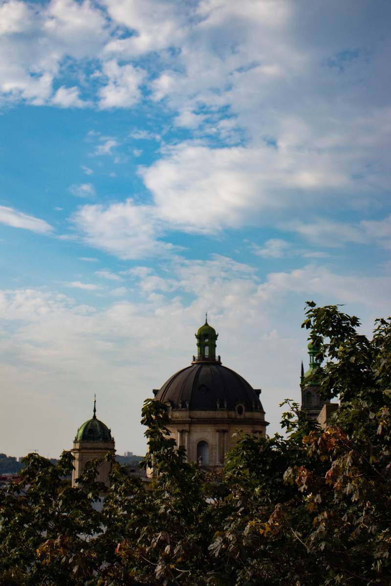 building trees near building during day dome