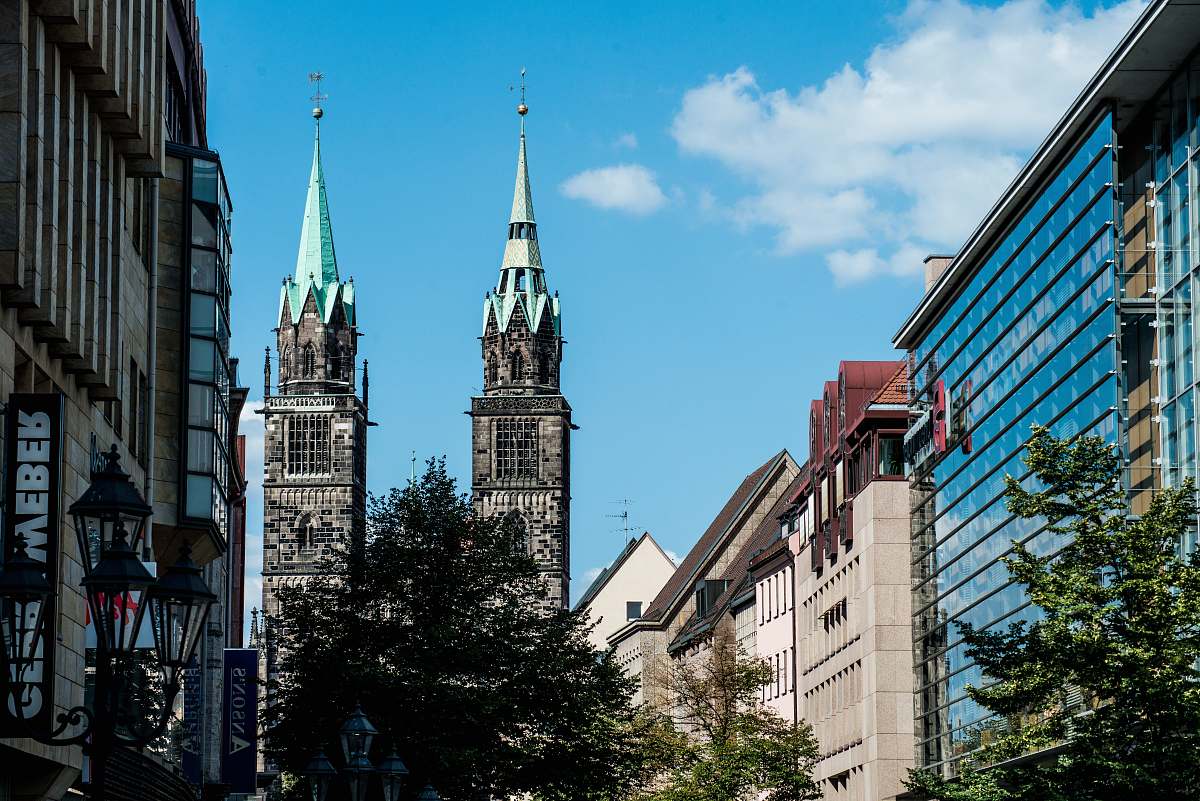 building two gray high rise buildings spire