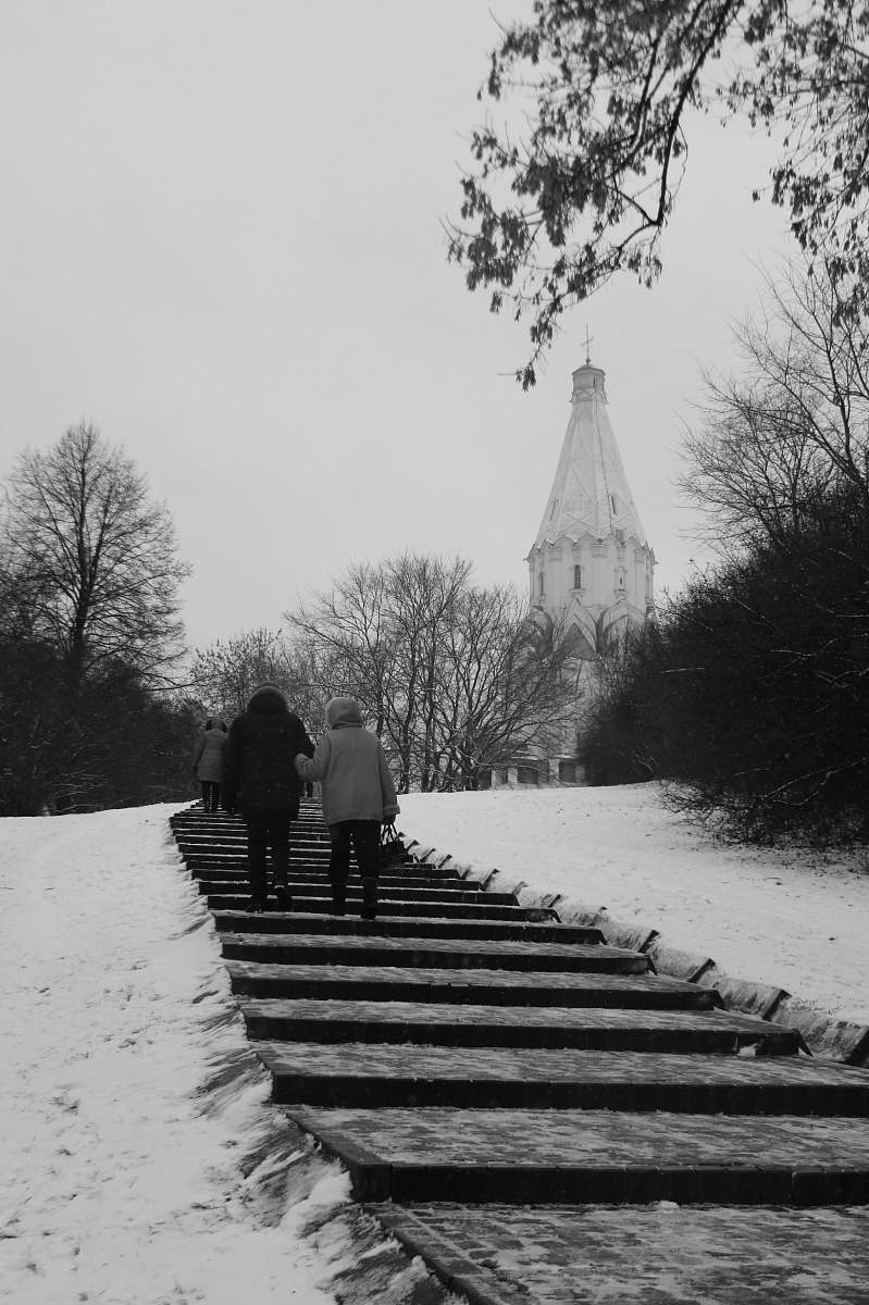 building two people walking on stairs black-and-white
