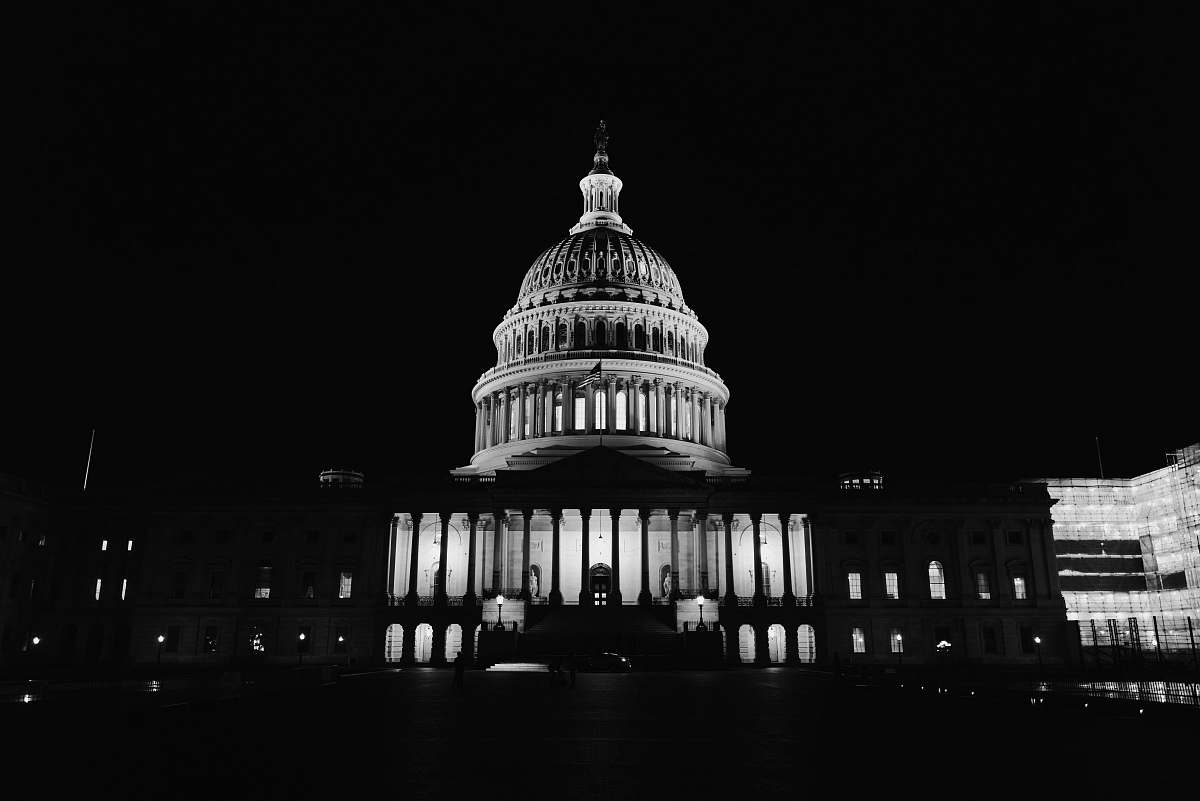 building United States Capitol, Washington DC during night black-and-white