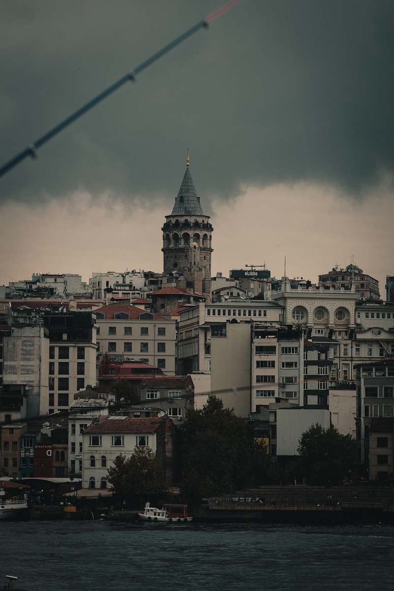 building white and black concrete building under gray sky tower