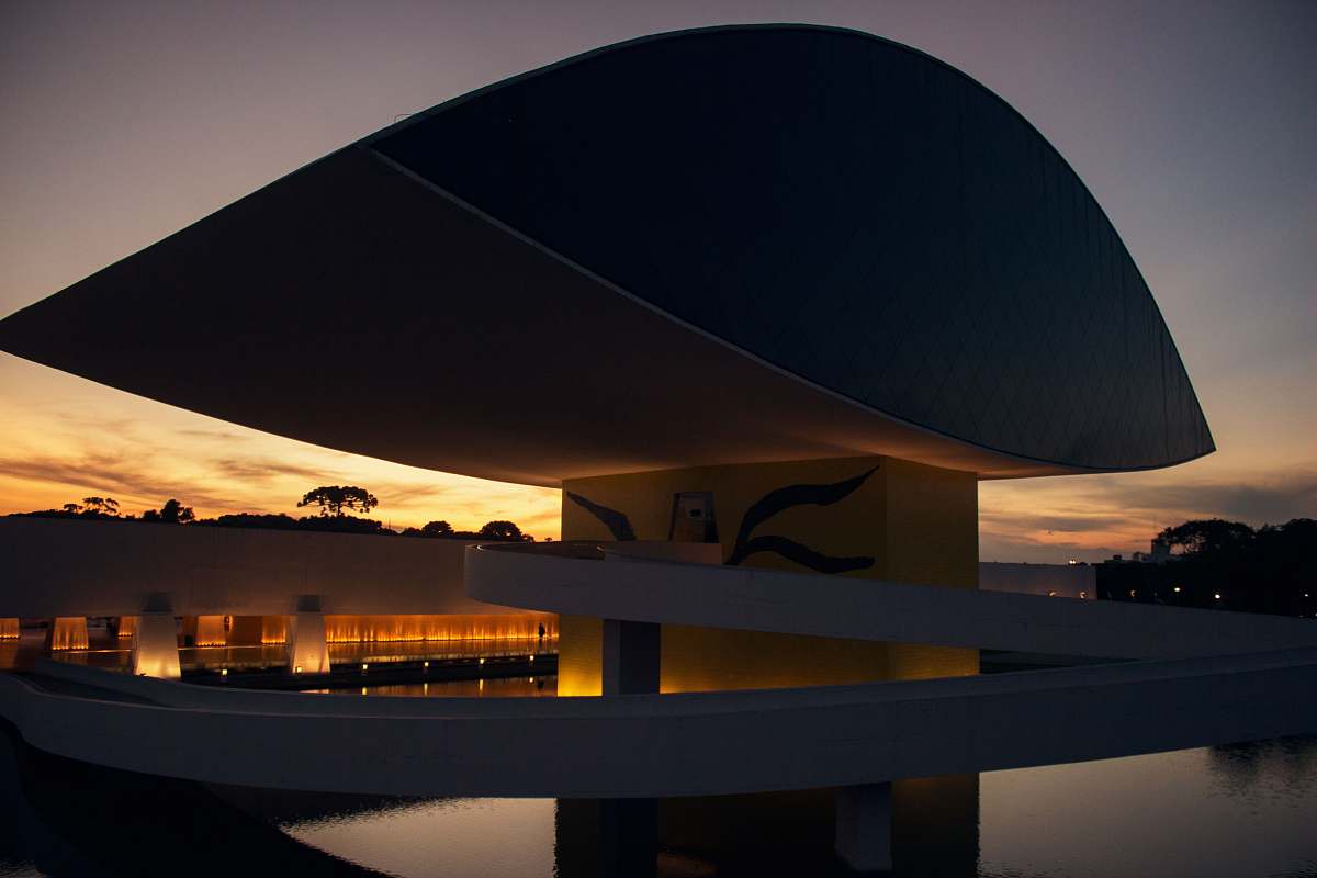 building white and black concrete modernize building with lights on curitiba
