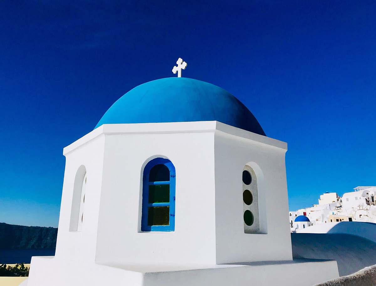 building white and blue mosque across sky dome