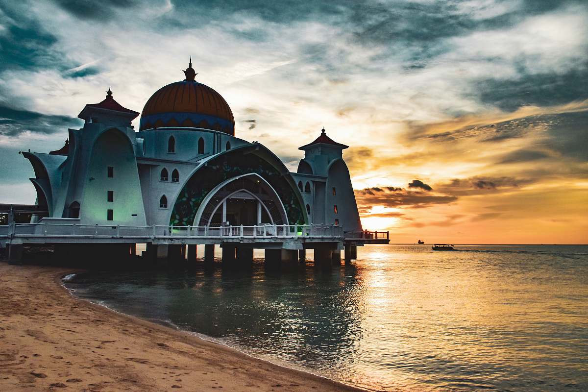 building white and brown dome building on body of water dome