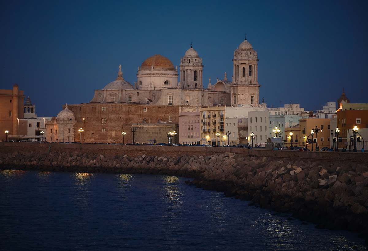 building white and brown mosque near body of water dome
