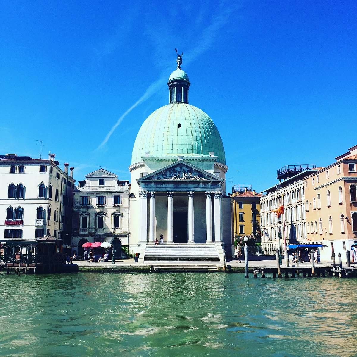 building white and teal concrete building dome