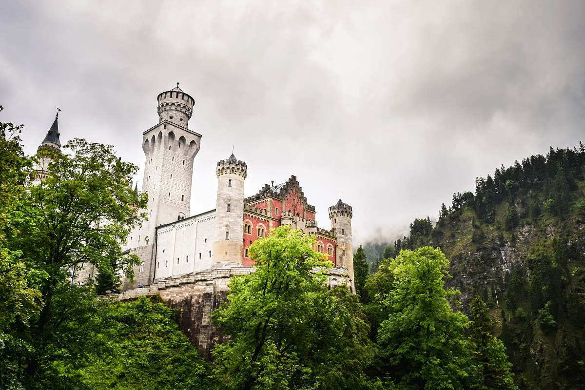 building white architectural structure on mountain castle
