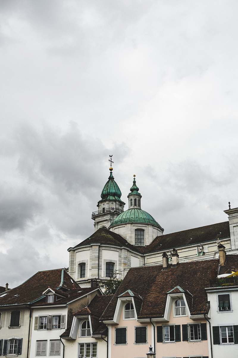 building white, brown, and green cement church dome