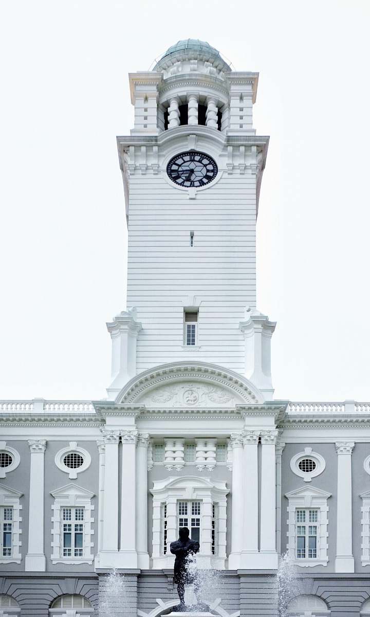 grey white building during daytime tower