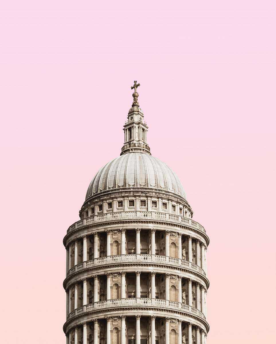 building white concrete building under clouds dome