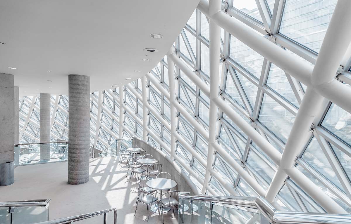 building white concrete building with chairs grey
