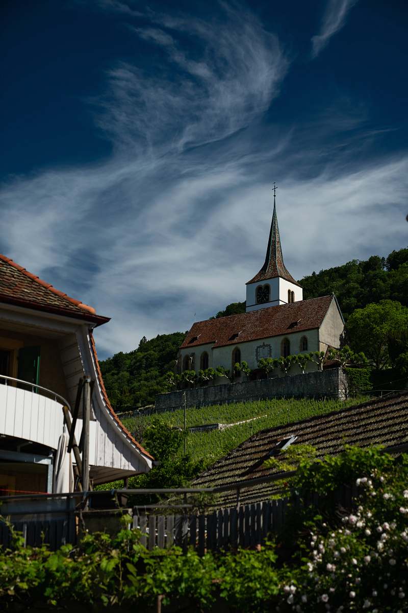 building white concrete house during daytime' spire