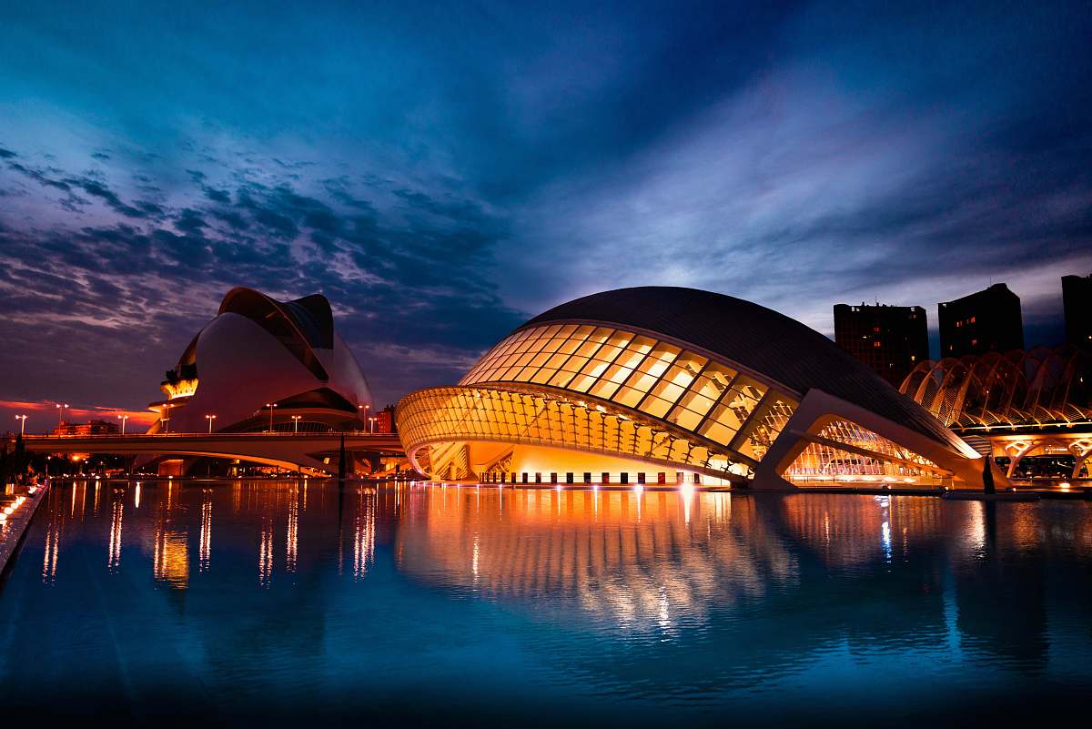 building white concrete structure beside body of water opera house