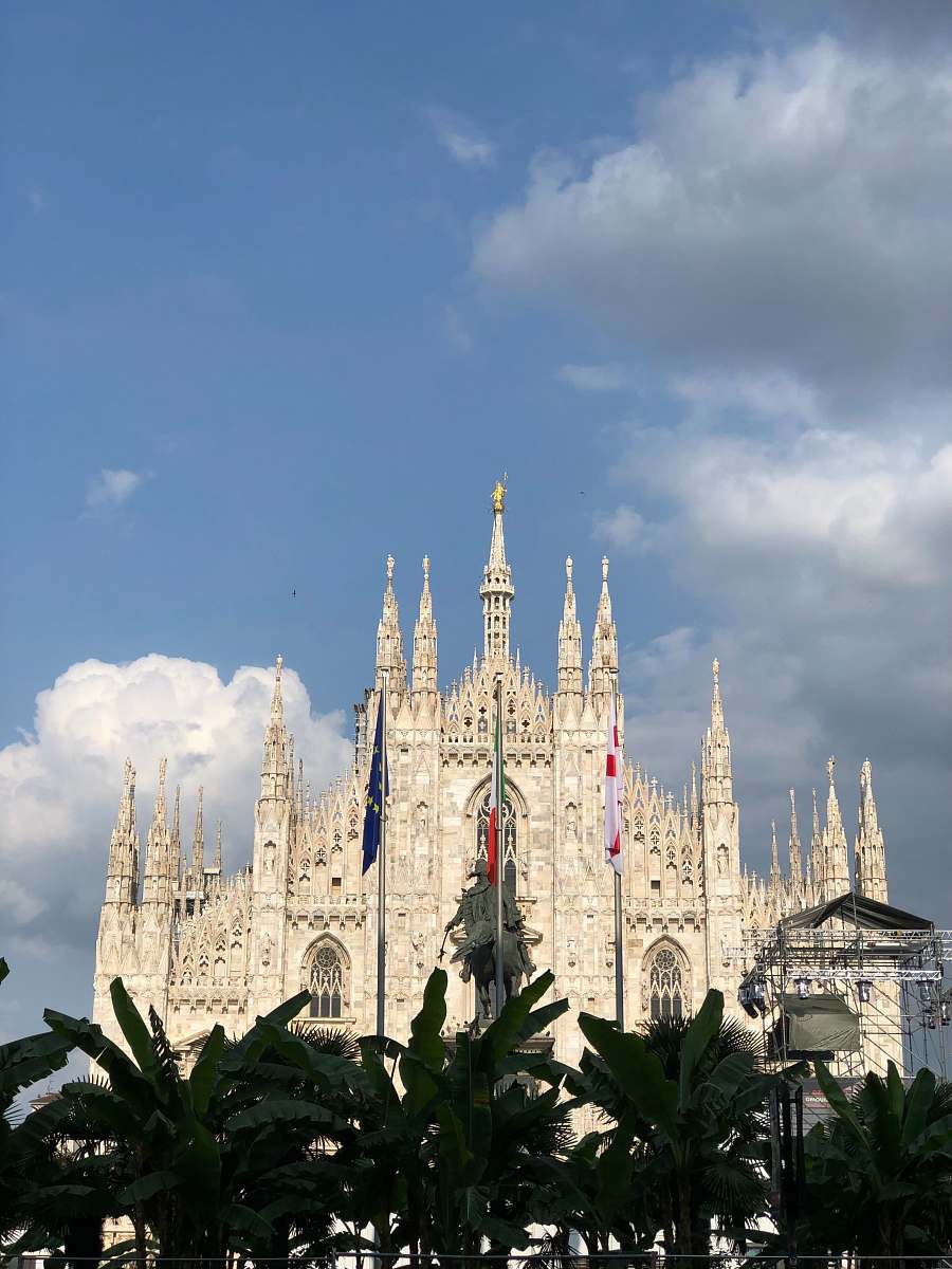 building white Gothic building with view during daytime spire
