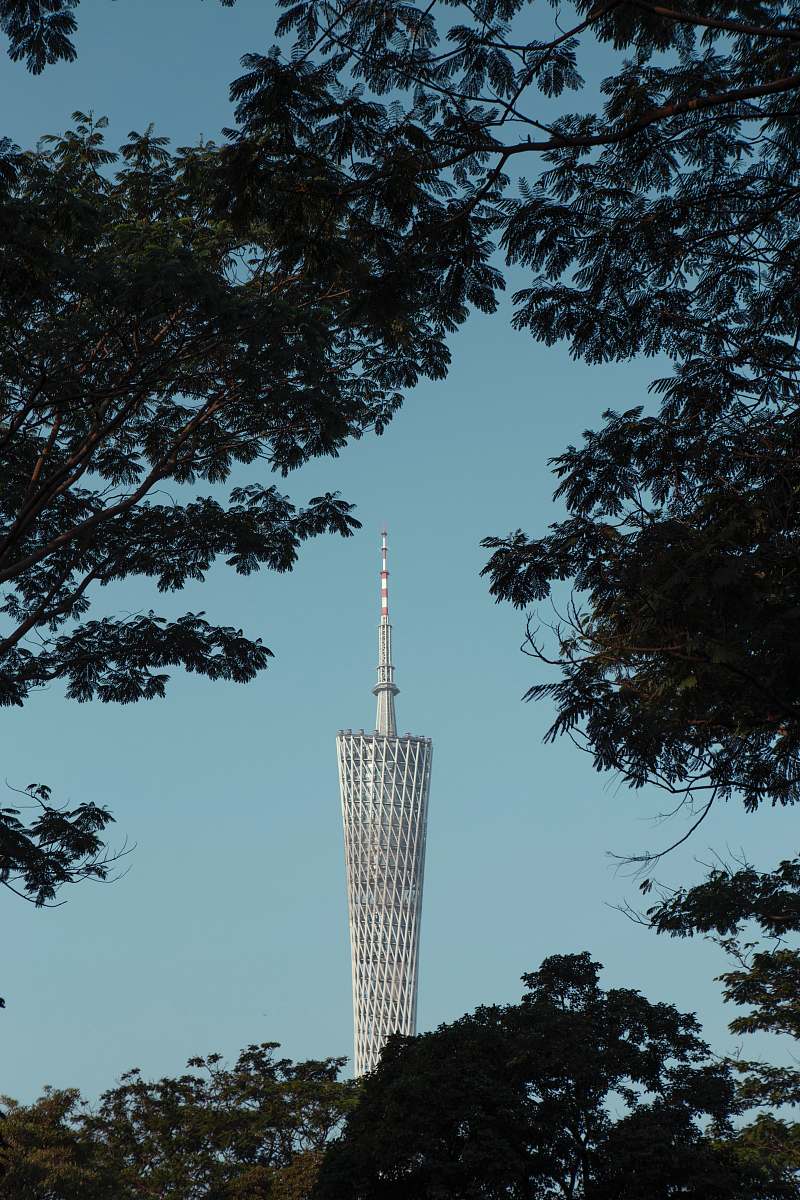 building white tower near trees during daytime spire
