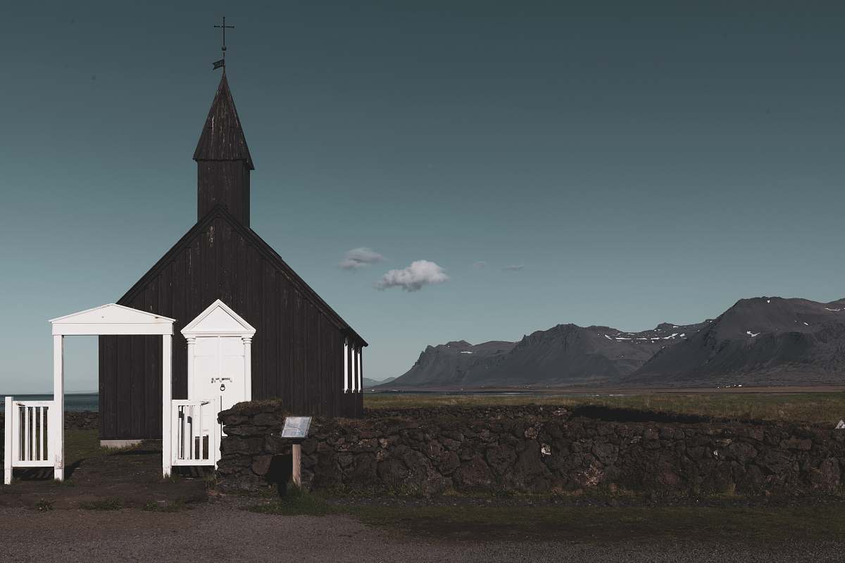 building white wooden gate spire