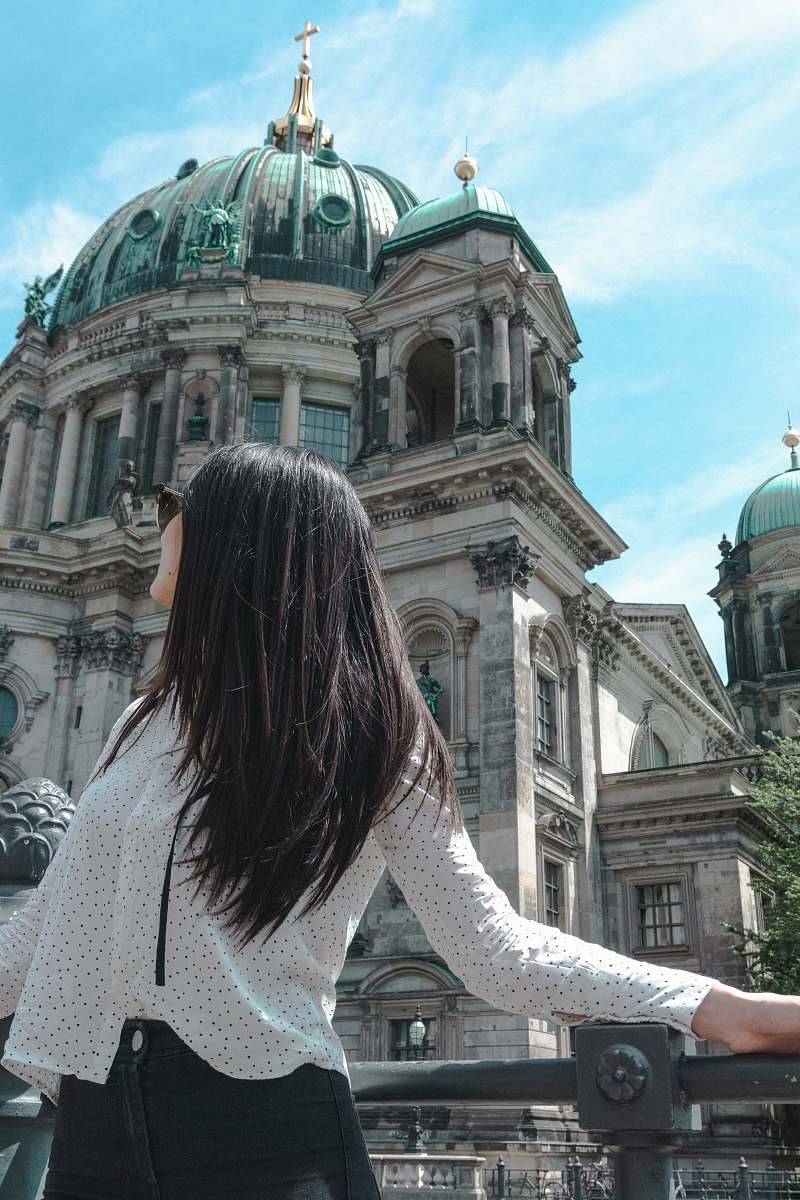 building woman wearing white long-sleeved shirt dome