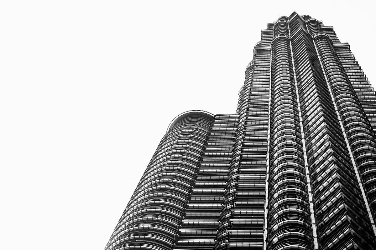 black-and-white worms eyeview of gray building skyscraper