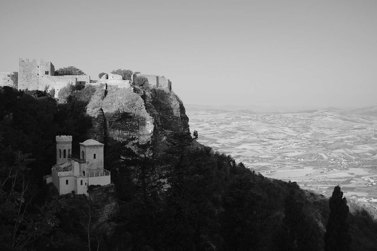 black-and-white body of water and castle castle