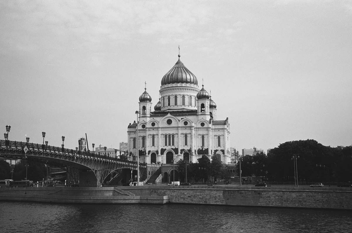 architecture bridge near building during day black-and-white