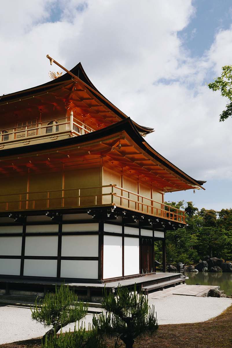 temple brown and white wooden house under white cloud during daytime shrine