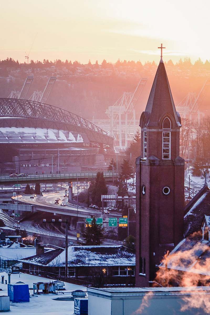architecture brown building under white sky spire