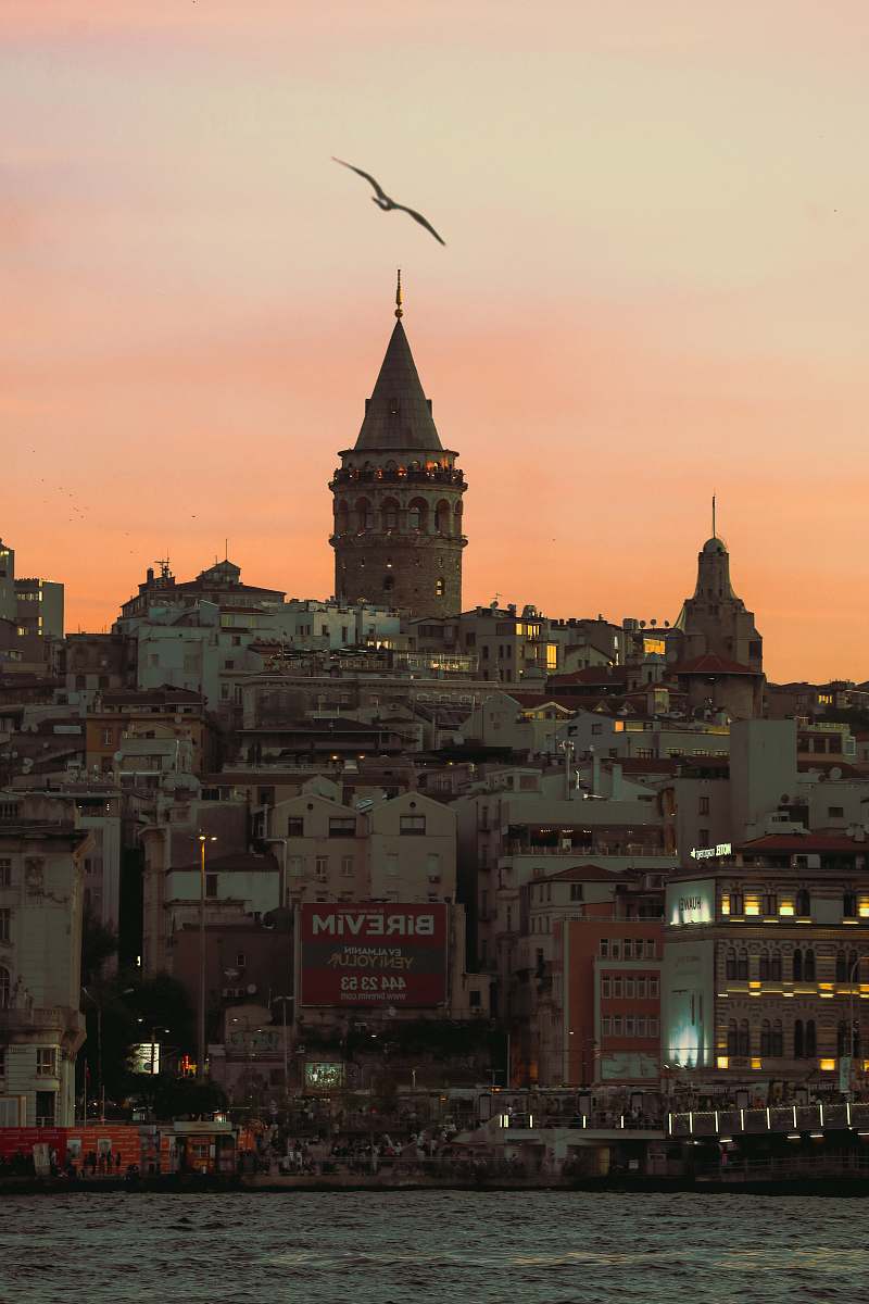 architecture buildings near body of water spire